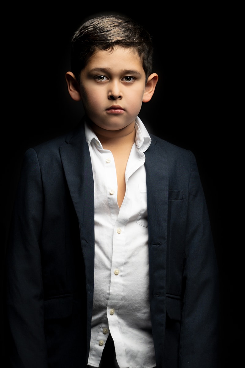 Denver Children's Photography, boy in white button up shirt and black coat